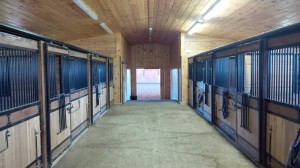 Beautiful stable interior with 22 box stalls, 12'x12', all with Soft Stall flooring